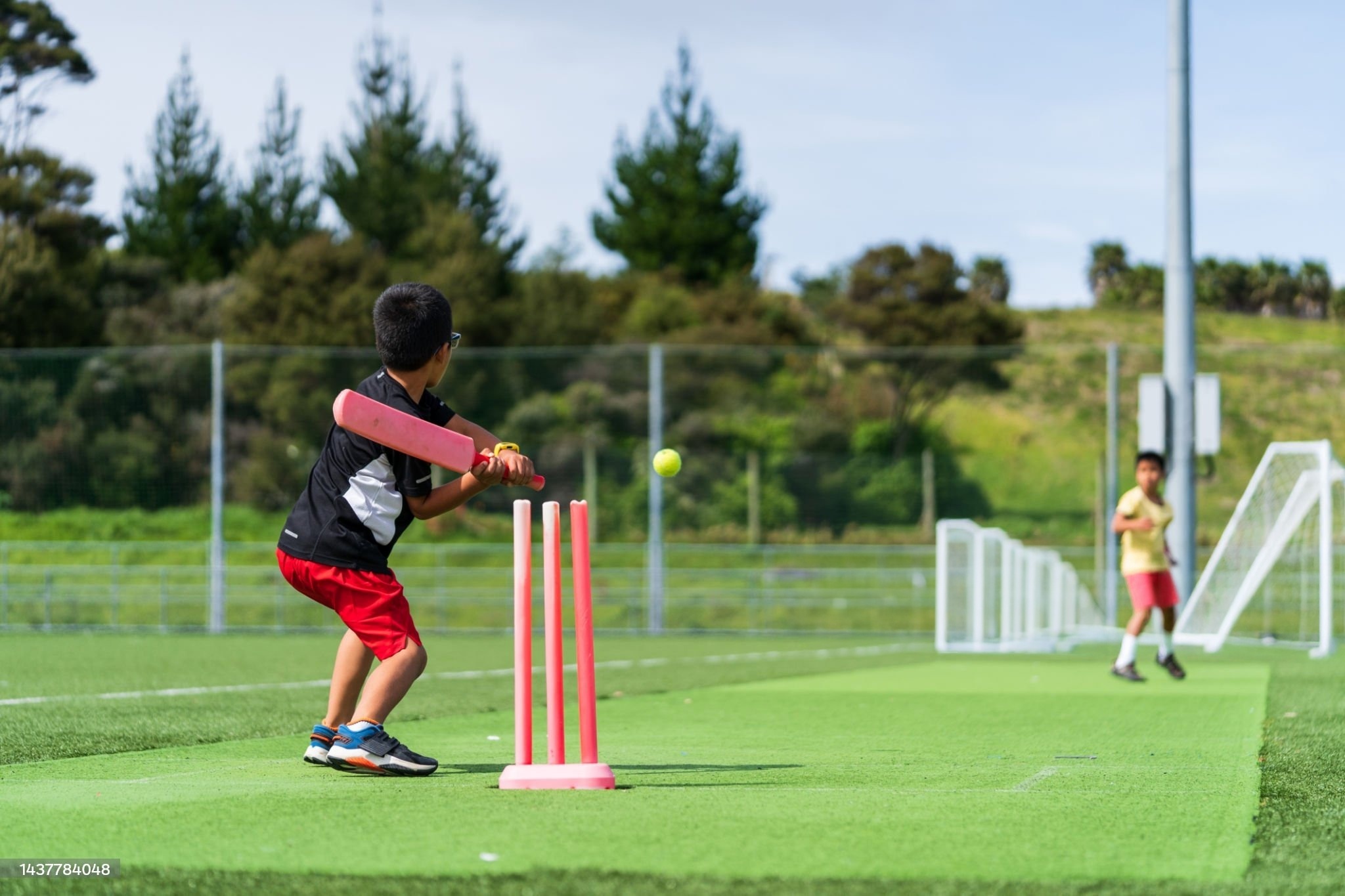 A picture of kids playing cricket